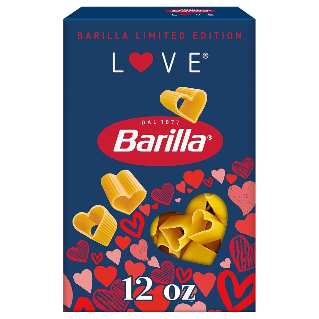 Heart-shaped pasta served as creamy mac and cheese on a pink and red heart-shaped plate