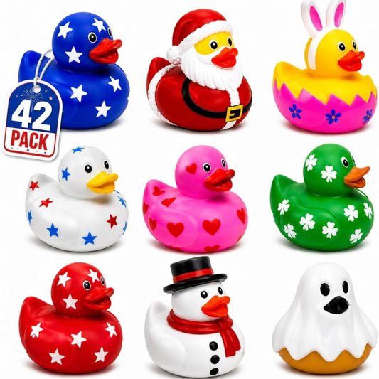 A set of 9 colorful rubber duck toys for kids, featuring designs like a blue duck with stars, a Santa Claus duck, a bunny duck in an egg shell, a white duck with red and blue stars, a pink duck with hearts, a green duck with clovers, a red duck with stars, a snowman duck with a top hat and scarf, and a ghost duck. A '42 PACK' tag is visible on the top left.