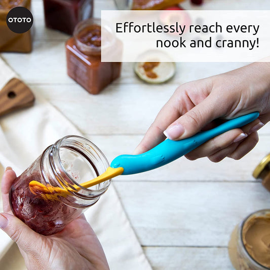 A person is using a kitchen scraper spatula to scrap the last bits of jam out of a jar.