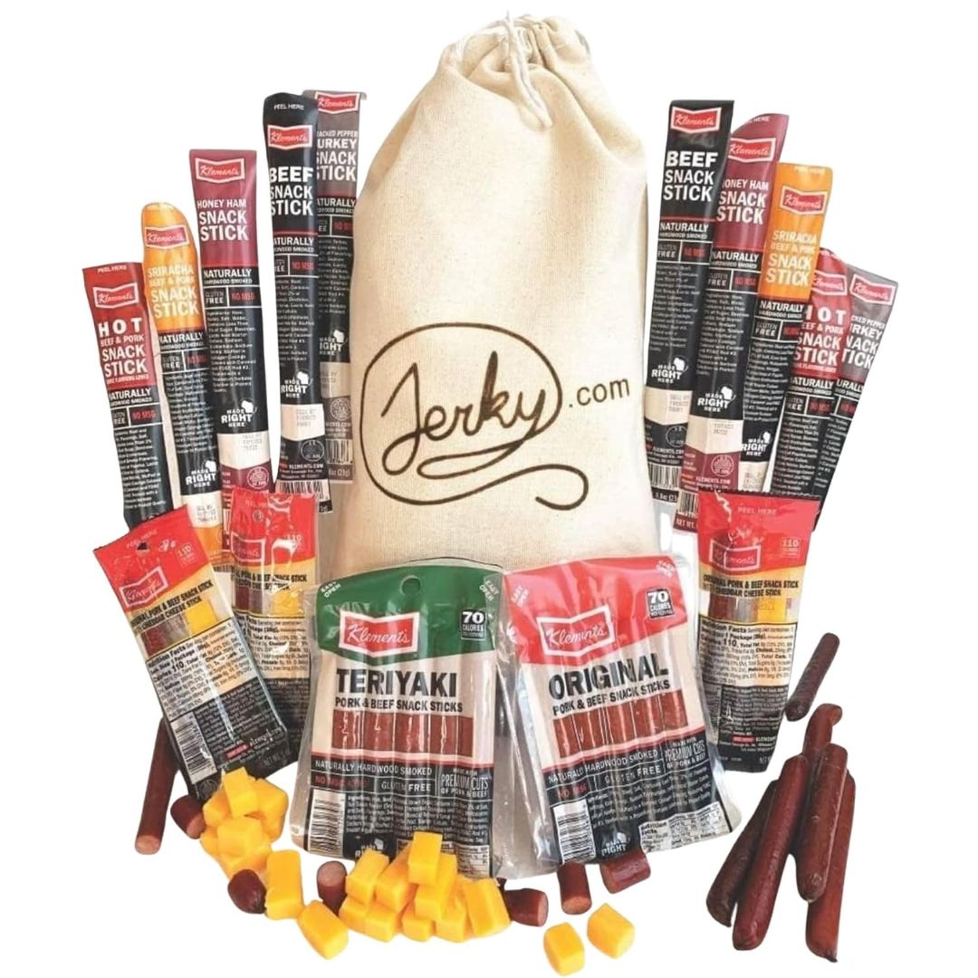 Assorted jerky sticks and a drawstring bag with 'Jerky.com' branding on a white background.