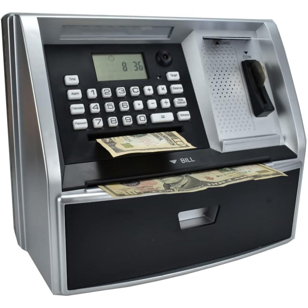 A silver and black kids toy ATM cash dispenser savings machine, shown with paper currency emerging from the front and a coin slot on the right side.