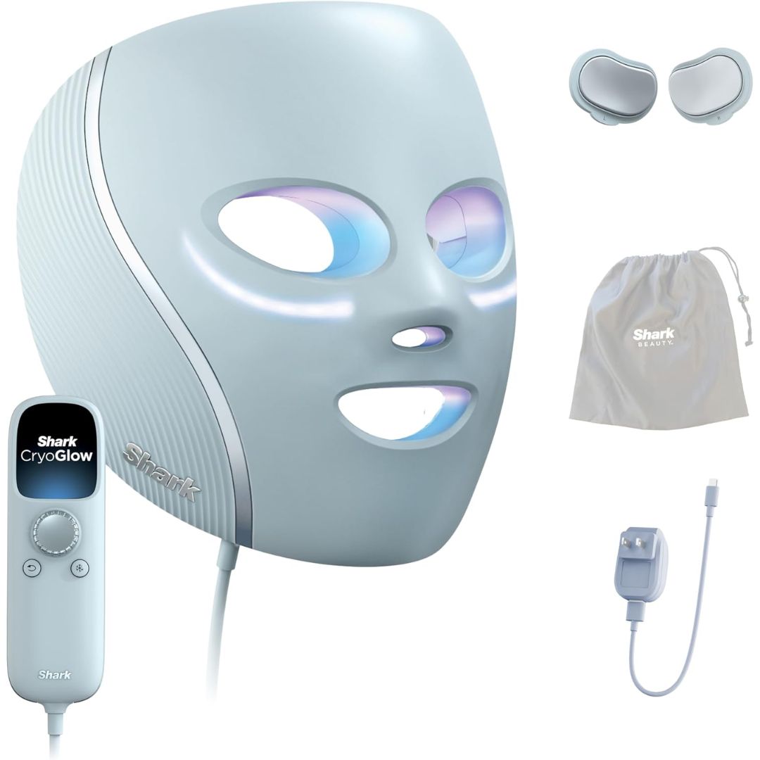 A Shark CryoGlow facial treatment device shown with its remote control, two gel pads, a drawstring storage bag, and a charging cable on a white background.