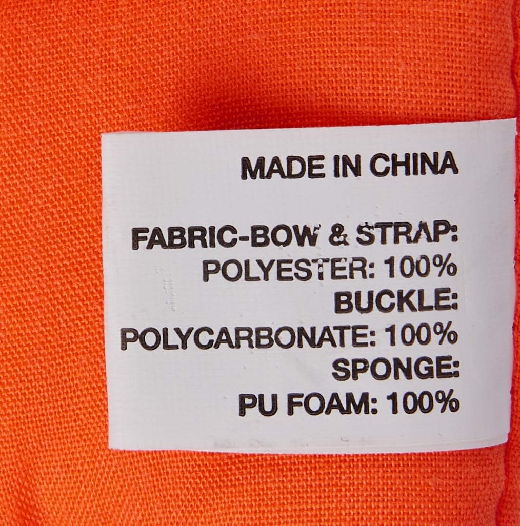 Close-up of white product tag on orange fabric listing materials: polyester, polycarbonate, and PU foam, with "Made in China" at the top.