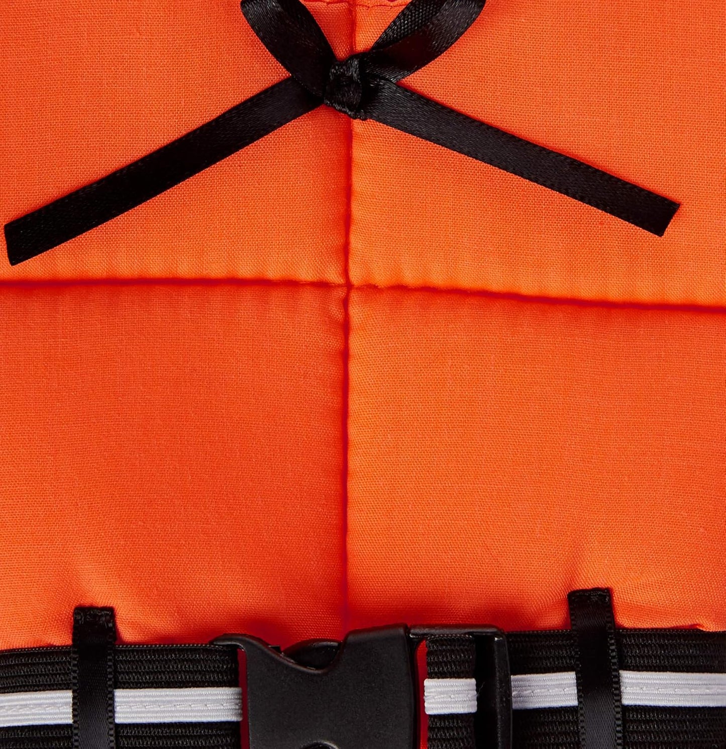 Close-up of orange life vest-style wine bottle cover, showing black ribbon bow and black buckle strap with white reflective stripe.