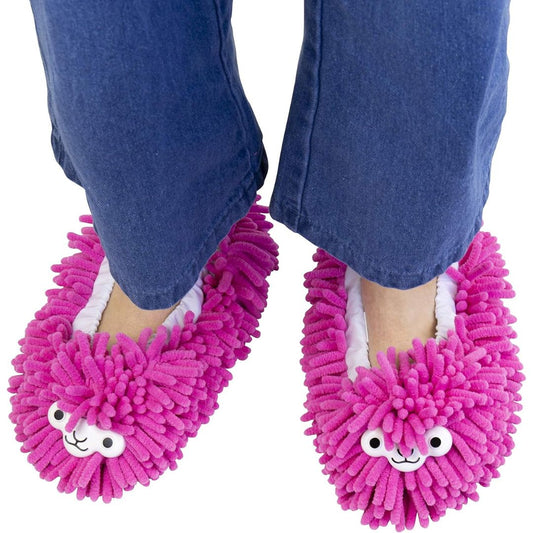 Pink llama cleaning slippers with fuzzy texture and smiling faces worn with blue jeans on a white background