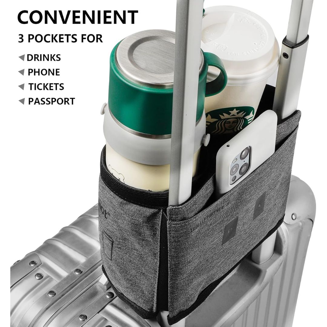 A dark gray fabric luggage sleeve with three pockets, shown attached to a silver suitcase and holding a green mug, a Starbucks coffee cup, and a white smartphone. Text on the left reads 'CONVENIENT 3 POCKETS FOR DRINKS PHONE TICKETS PASSPORT'.