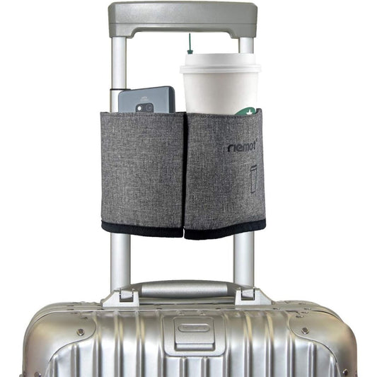 A airport travel luggage cup holder travewl drink carrier attached to the handle of a suitcase holding a Starbucks coffee and a cell phone