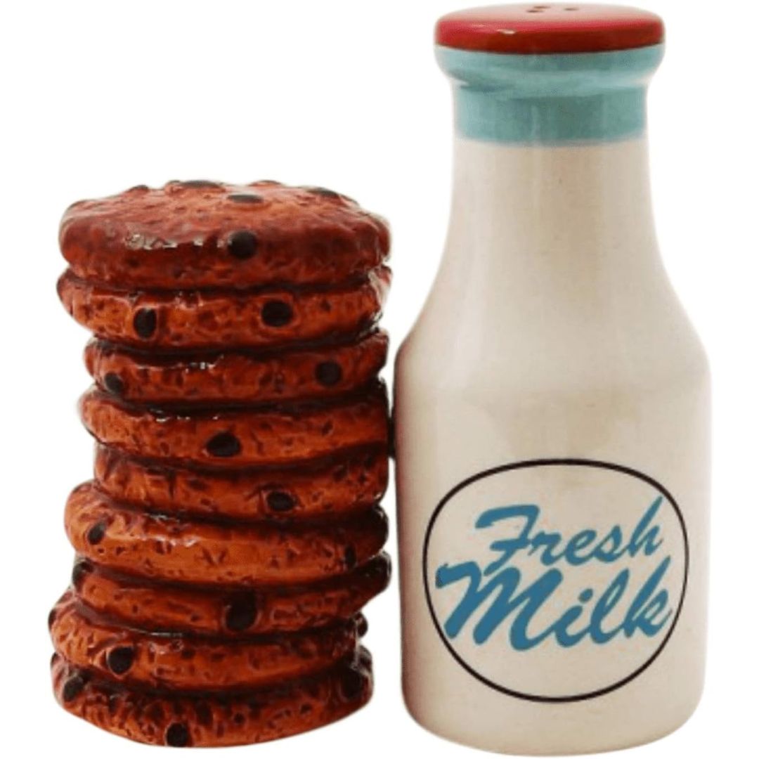 Salt and pepper shakers that look like a stack of chocolate cookies and a ceramic milk bottle with 'Fresh Milk' text on a white background