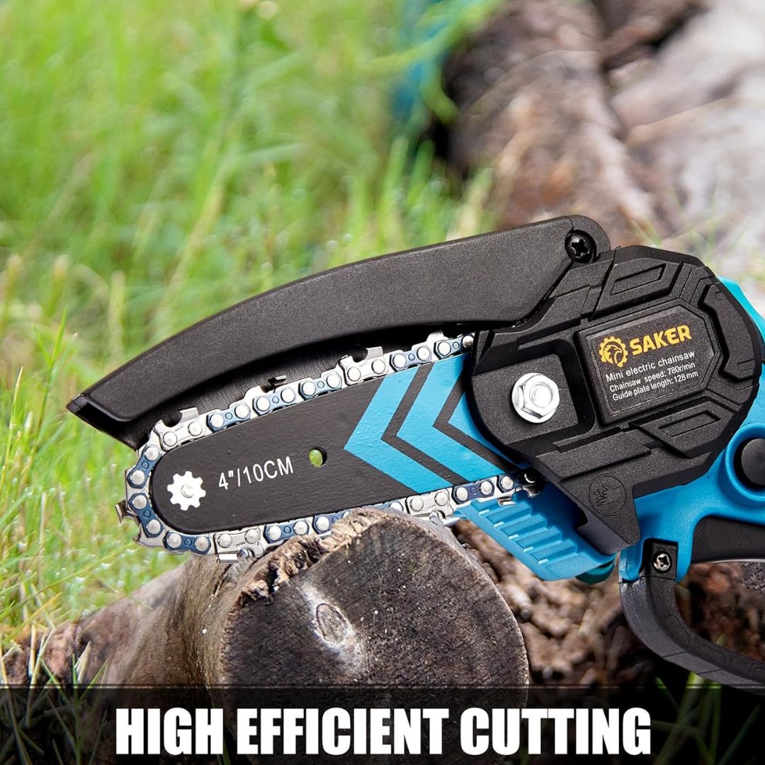 A mini electric chain saw with wood and grass in the background