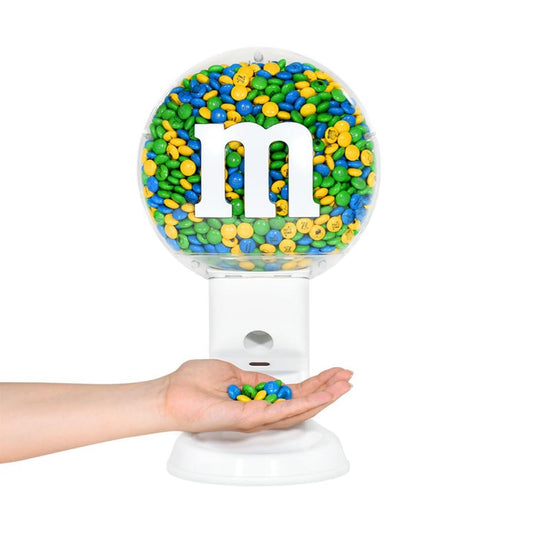 White M&M’s candy dispenser with clear globe filled with colorful chocolates and hand-operated dispensing tray