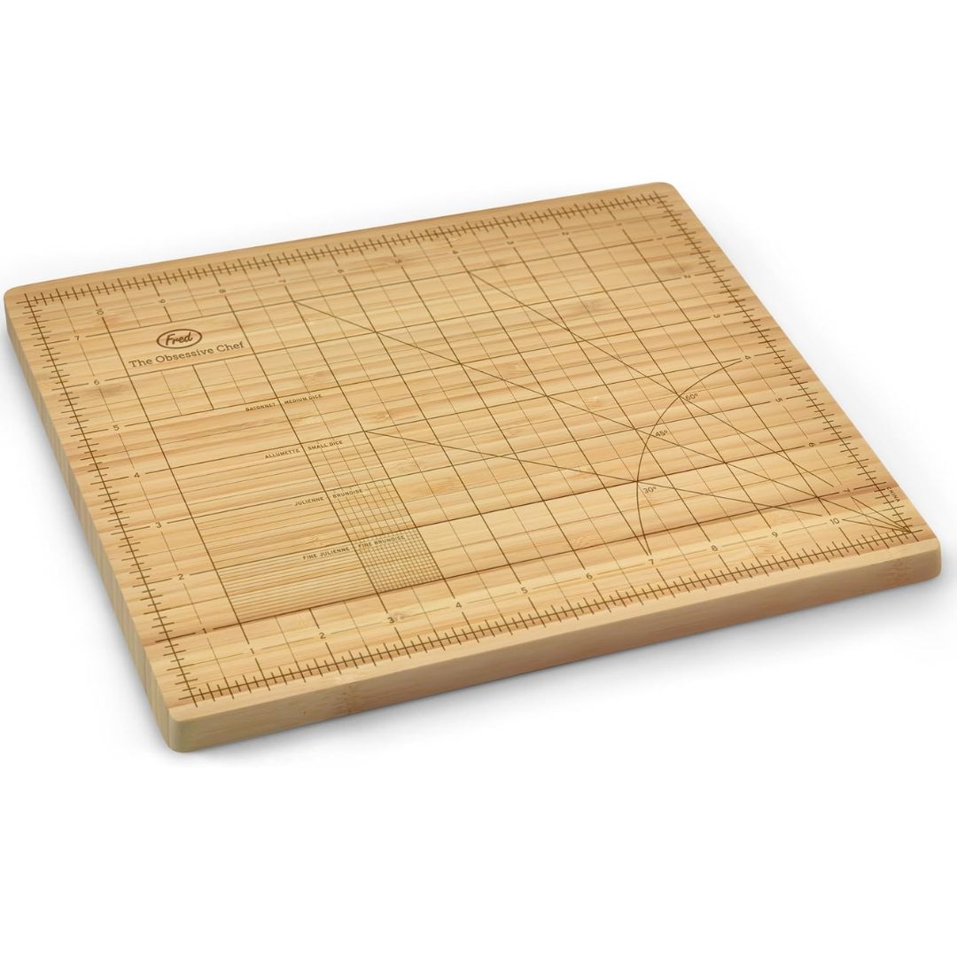Bamboo cutting board with grid and measuring patterns on a white background