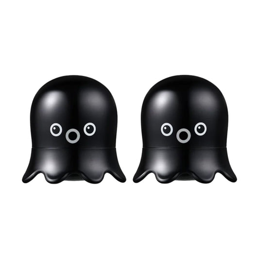Two black octopus-shaped blackhead scrub stick with cute white and gray cartoon eyes, shown side by side on a plain white background.