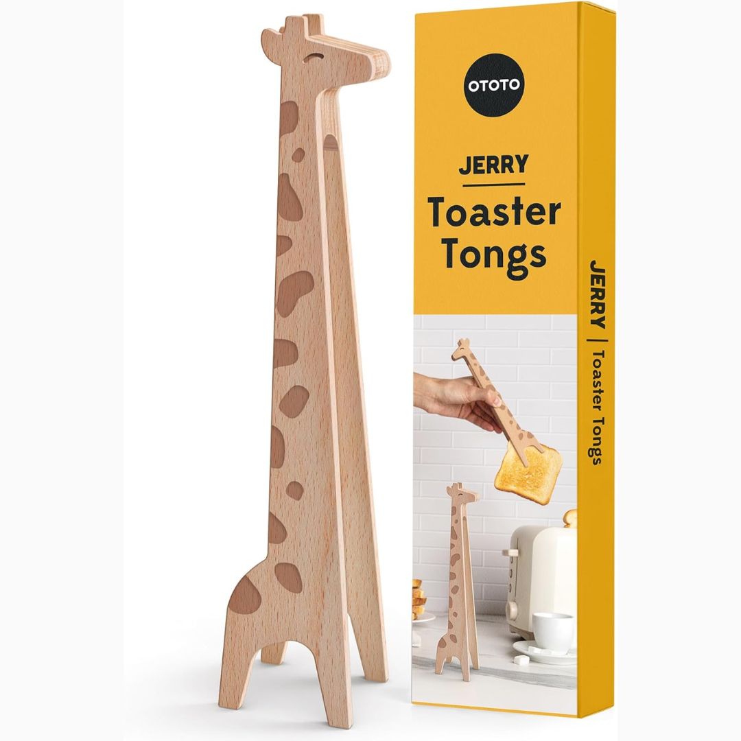 Giraffe-shaped toaster tongs next to their packaging box on a white background