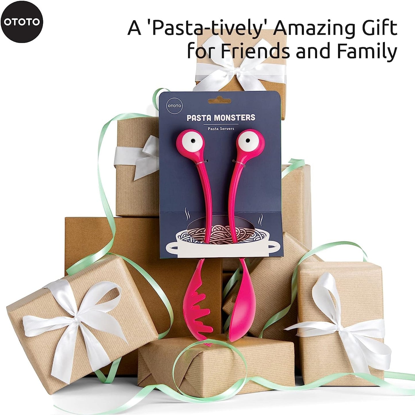 A fun pair of pasta and salad servers with eyeballs that resemble a monster. There are brown gift wrapped packages in the background.