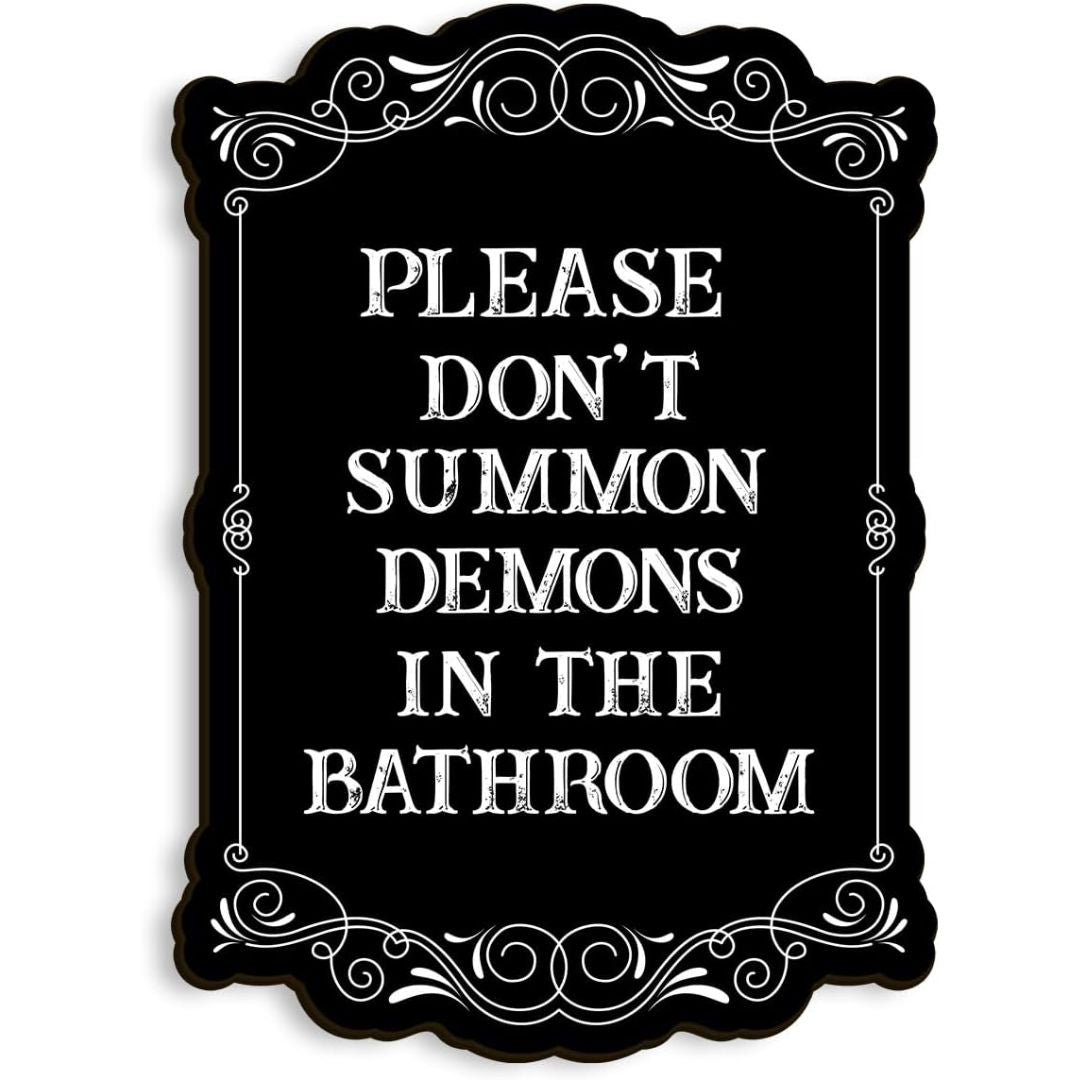 A black sign which reads, 'Please don't summon demons in the bathroom' on a white background.