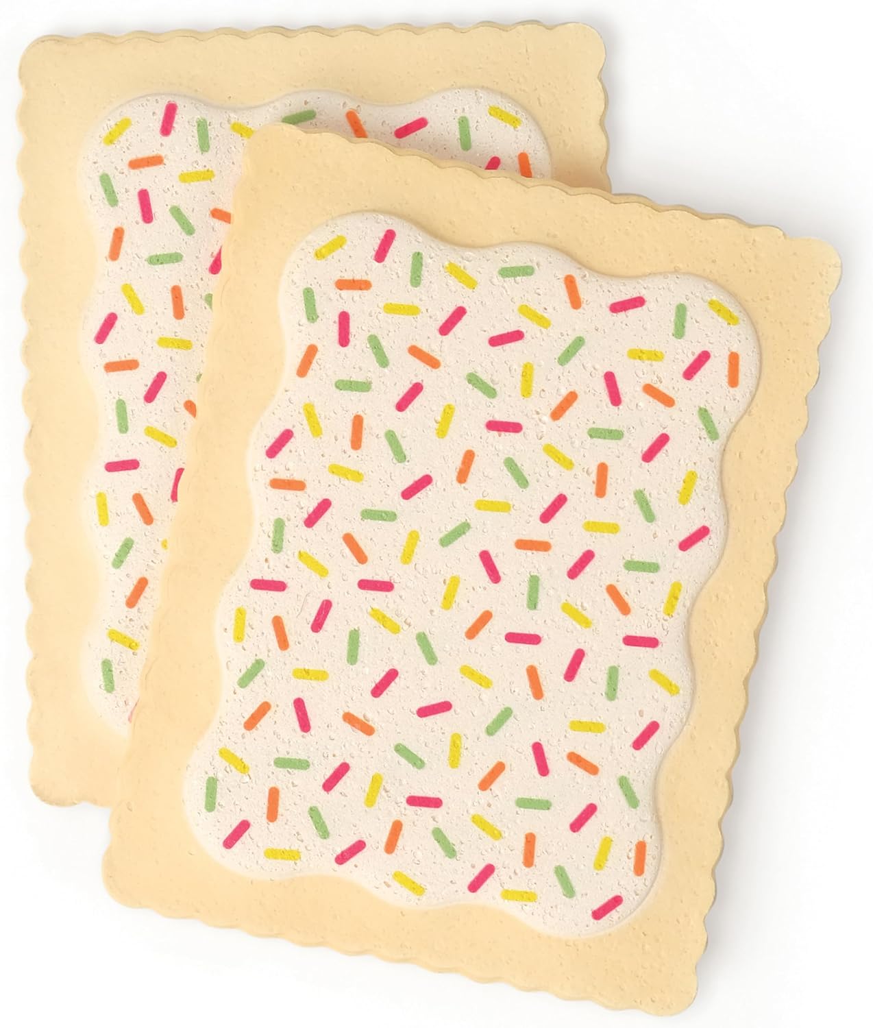 Three beige kitchen sponges shaped like Pop-Tarts with white icing and colorful sprinkles, stacked on a white background.