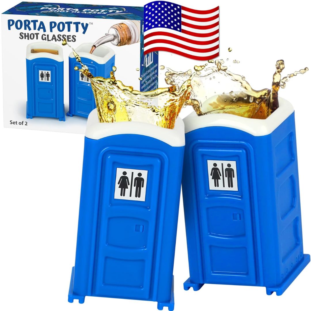 Two blue porta potty-shaped novelty shot glasses with white rims, shown with a liquid splash effect and the product box in the background. An American flag graphic appears near the top.