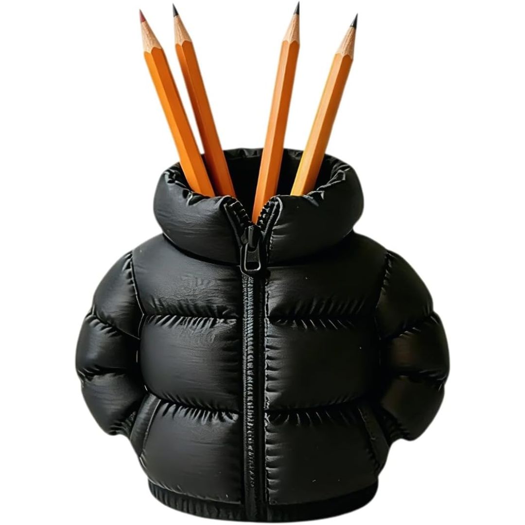 A novelty pencil holder shaped like a black puffer jacket, holding four orange wooden pencils, isolated on a white background.