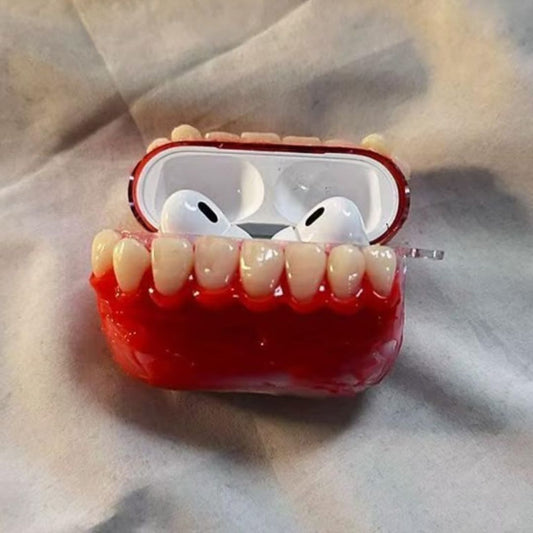 Funny realistic teeth AirPods case opened to reveal white earbuds inside the red gum design
