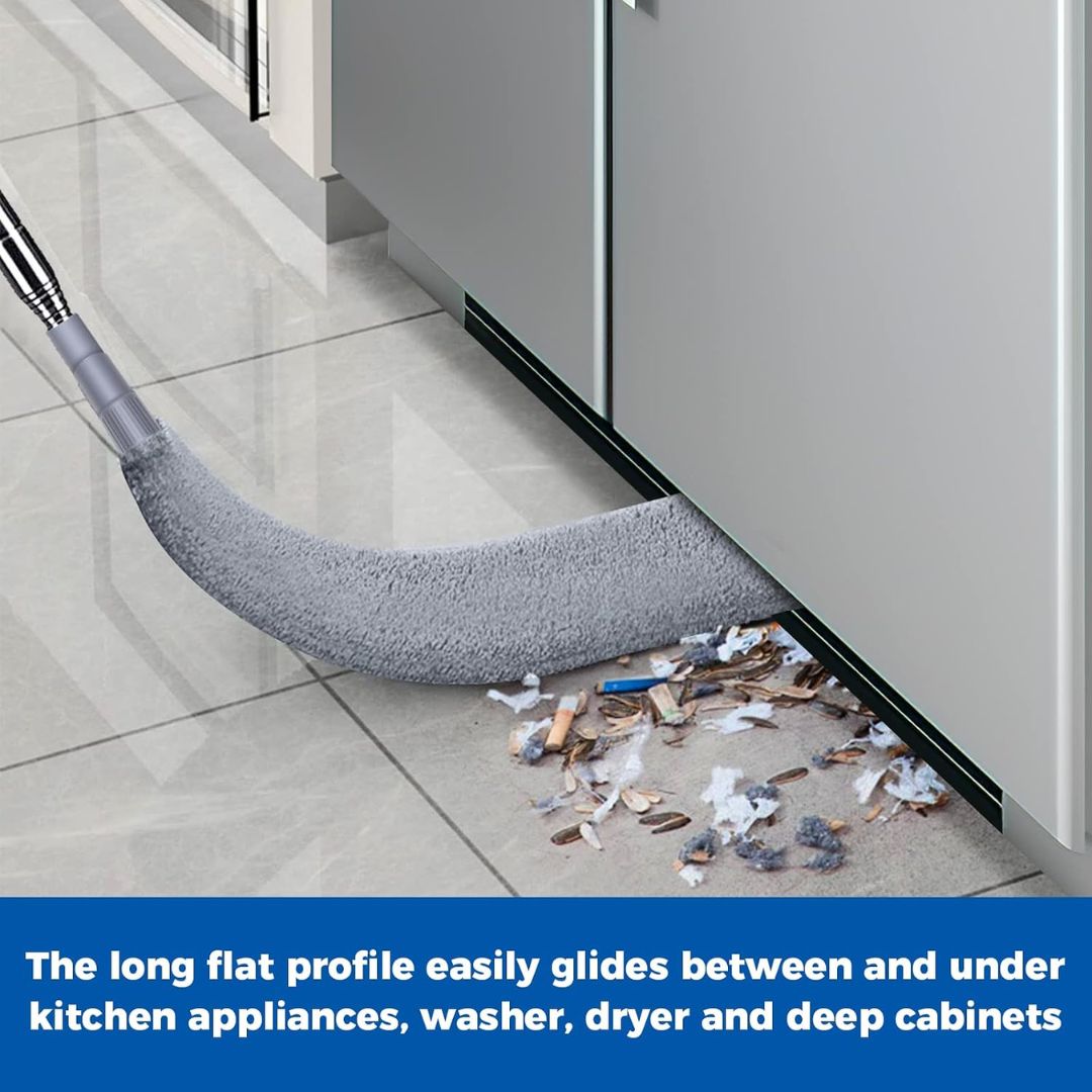 Flexible flat microfiber gap duster cleaning dust and debris from underneath a kitchen appliance