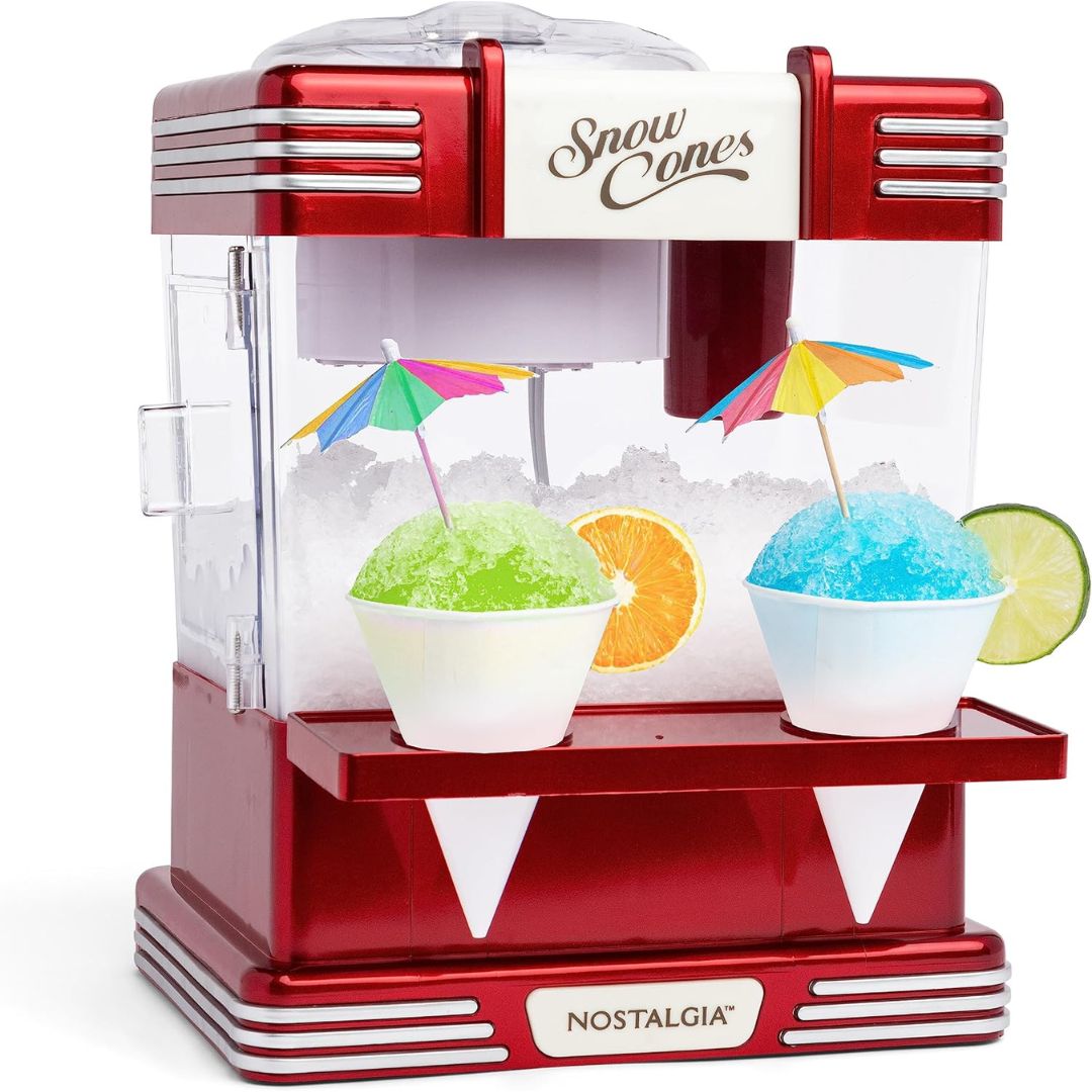 Red snow cone machine with two cups of shaved ice and colorful umbrellas on a white background