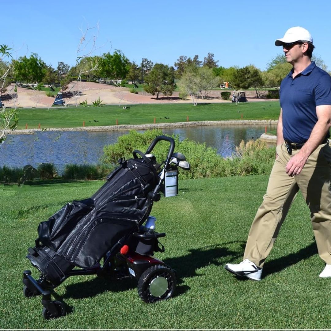CaddyTrek R2 smart robotic electric golf caddy following a golfer across a golf course while carrying a golf bag