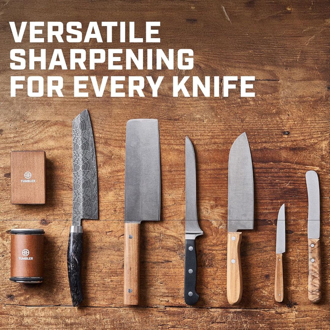 Various different knives with a rolling knife sharpener on a wooden background