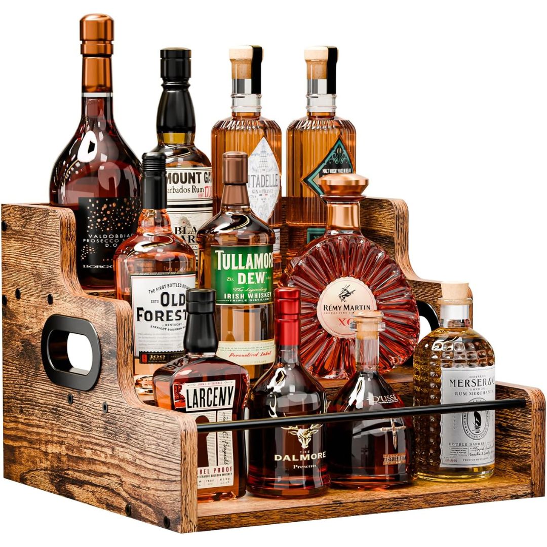 Collection of whiskey bottles in a wooden liquor display shelf on a white background