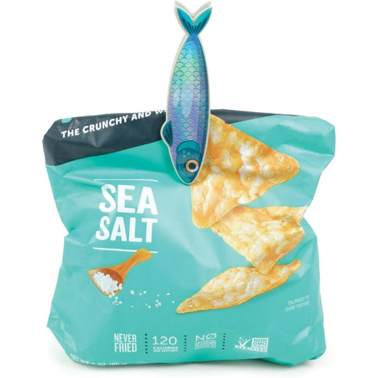 Fish-shaped food storage clip sealing an open sea salt chip bag, shown clipped across the top of the bag