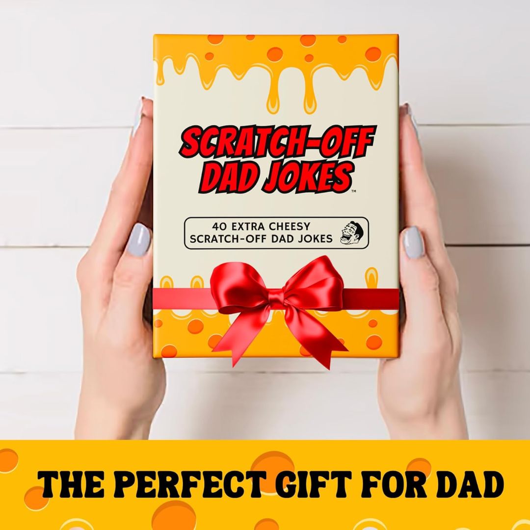 Scratch-off dad jokes gift box with a red bow held by hands on a white background