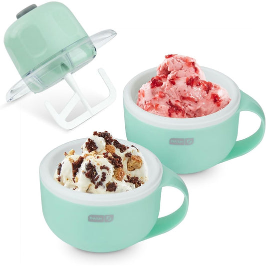 Two mint green ice cream maker bowls with handles shown on a white background, one filled with pink strawberry ice cream and the other with white chocolate chip ice cream, with the lid and mixing attachment displayed above.