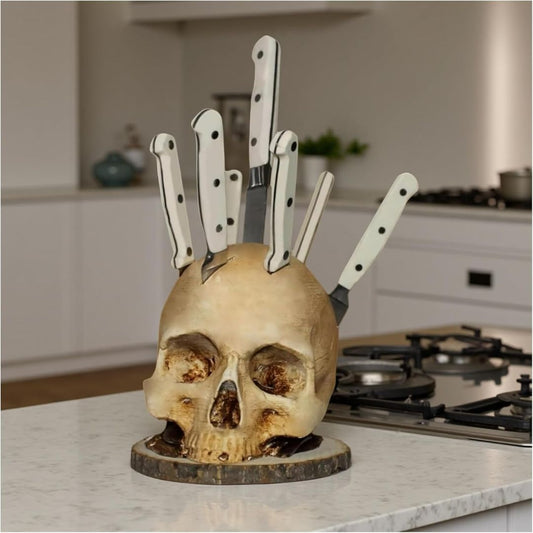 Skull-shaped knife holder with knives on a kitchen counter