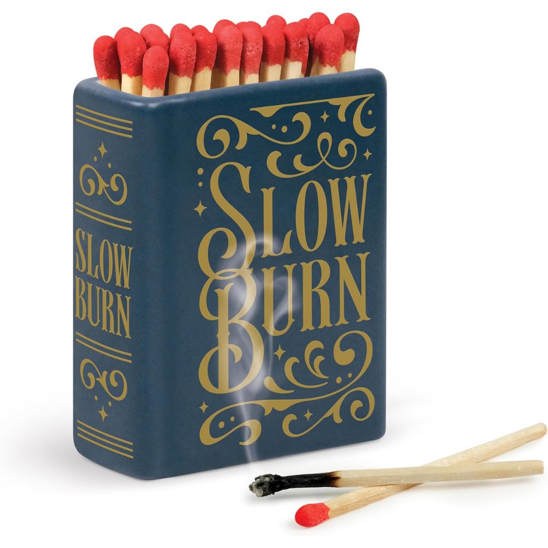 Ceramic book-style blue match holder labeled 'Slow Burn' on a white background