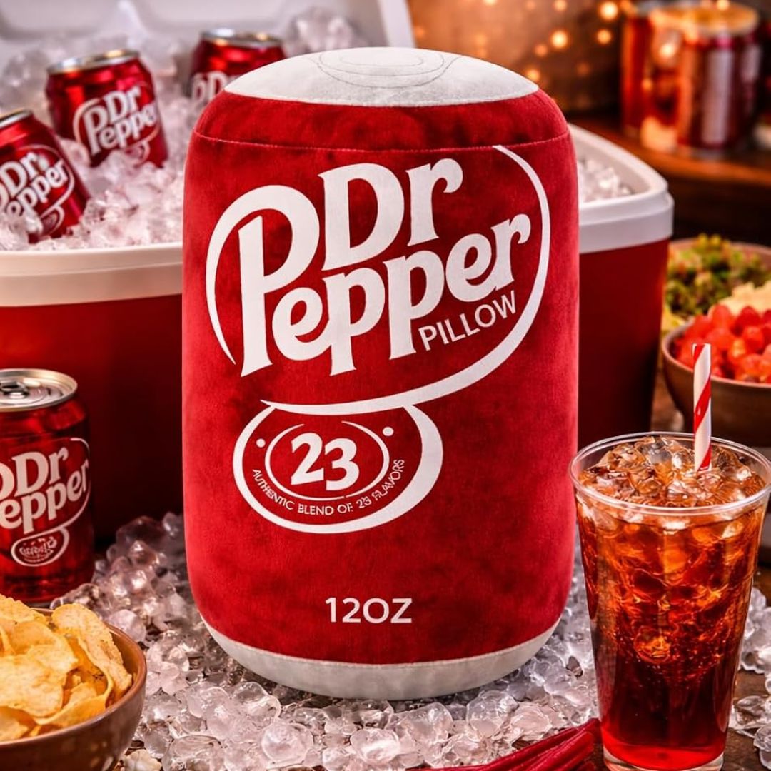 Dr Pepper pillow shaped like a can with a glass of Dr Pepper and snacks on ice.