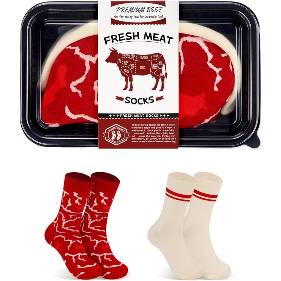 A novelty sock gift set featuring a black plastic clamshell package labeled 'Fresh Meat Socks' with two red patterned socks and two cream socks displayed below on a white background.