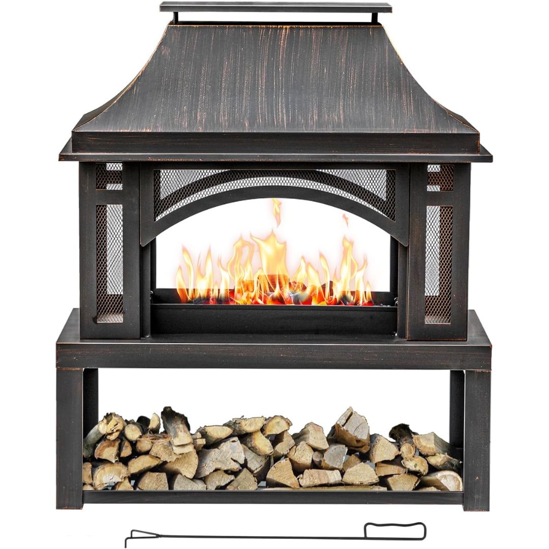 A freestanding outdoor fireplace with a dark brown/black weathered wood finish, featuring a faux flame effect in the center and a lower shelf holding stacked firewood. A metal poker is placed below the table on a white background.