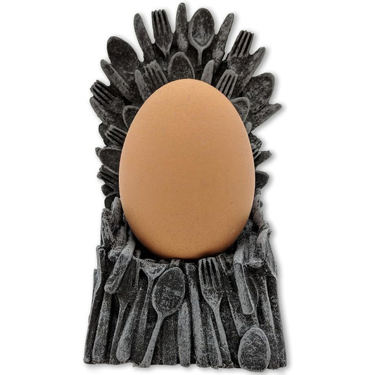 An egg sitting on The Iron Throne on a white background.