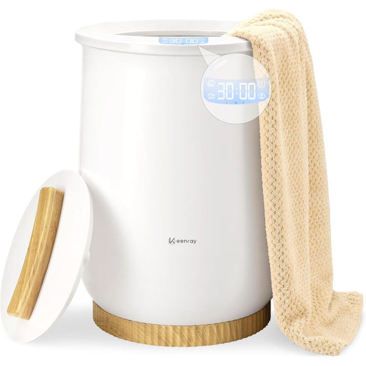 A white towel warmer bucket with a towel draped on one side on a white background