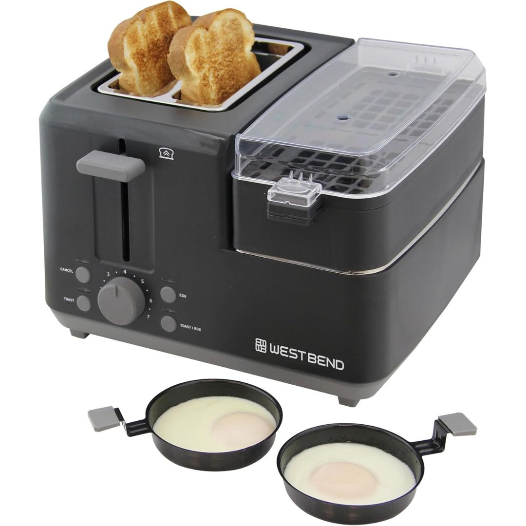 Black West Bend toaster with two slices of toast and two egg poachers on a white background