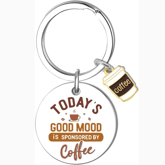 Keychain with 'Today's good mood is sponsored by coffee' text and coffee cup charm on a white background