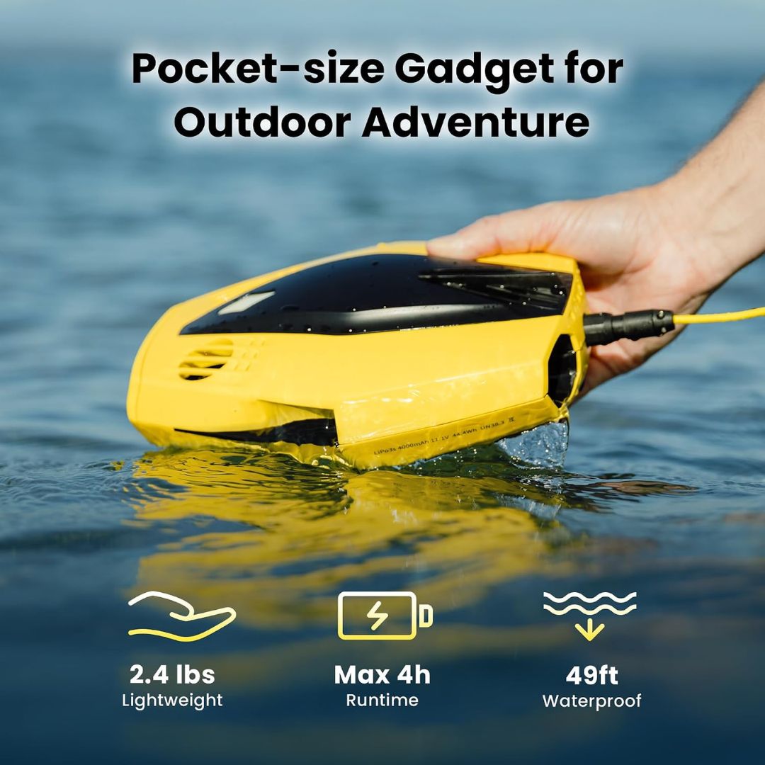 Compact yellow underwater camera drone being placed in the water for outdoor exploration