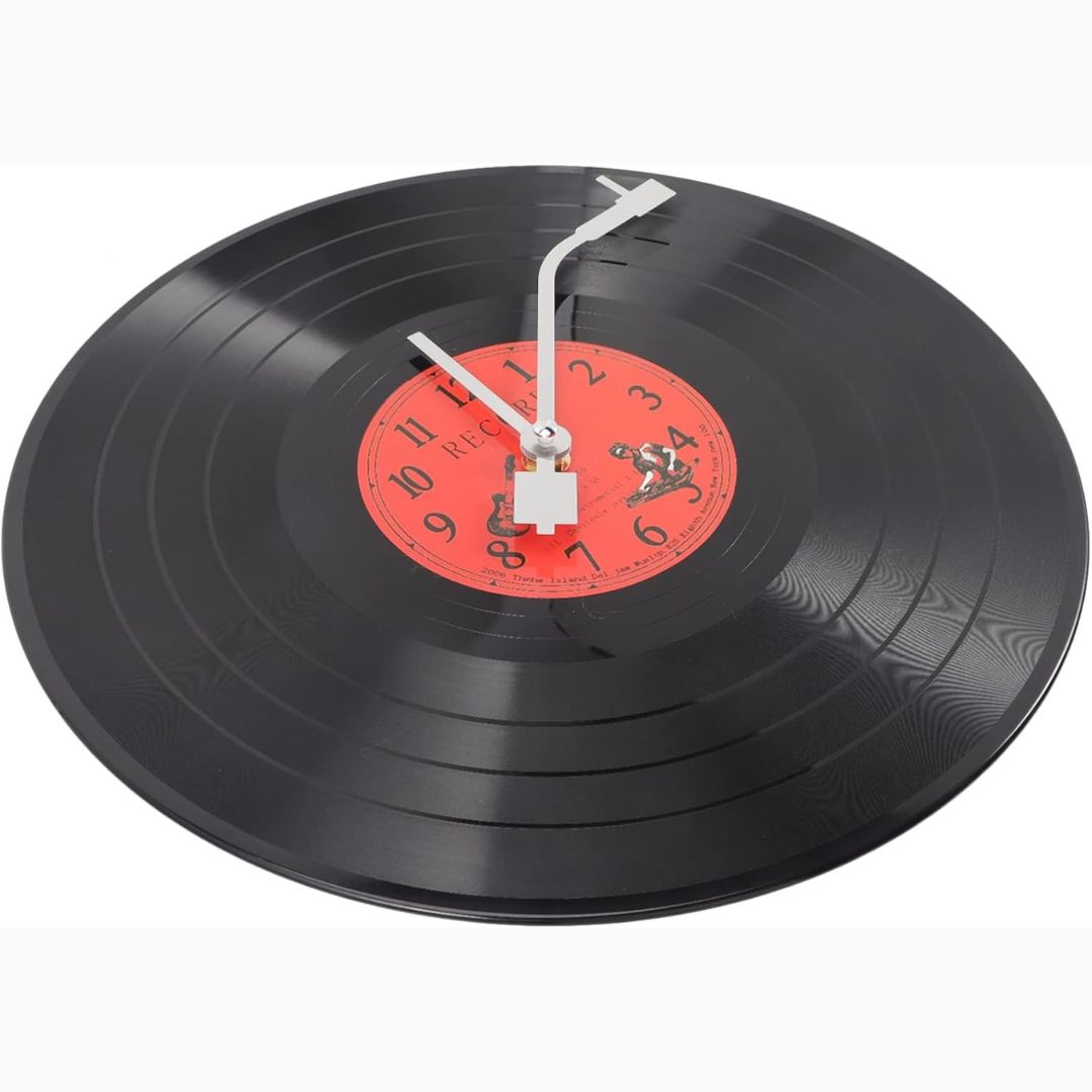 Vinyl record clock with a red label on a white background