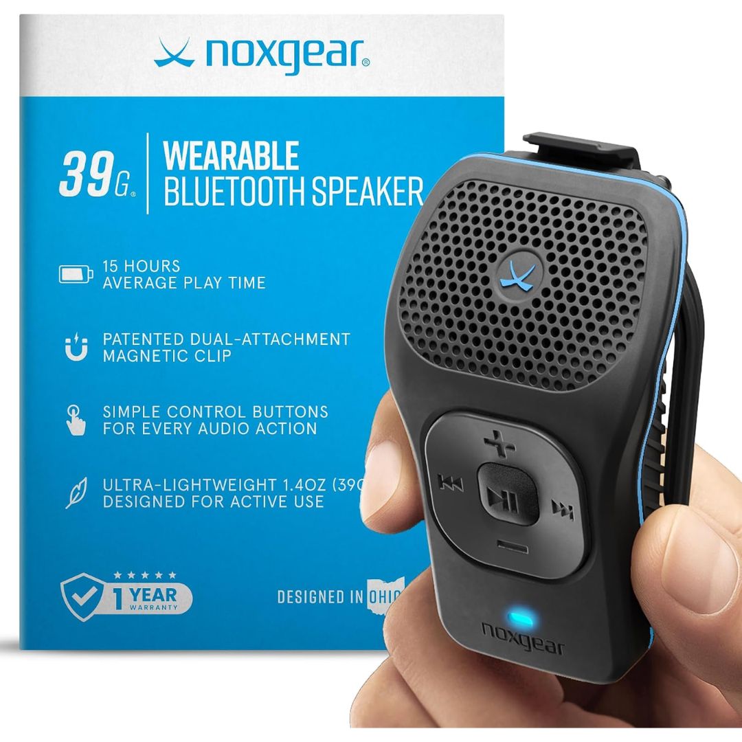 A hand holding a black Noxgear wearable Bluetooth speaker with blue accents, shown next to its blue and white retail box on a clean white background.