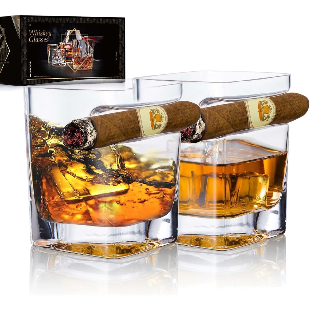 Set of two whiskey glasses with built-in cigar rests, filled with whiskey and cigars