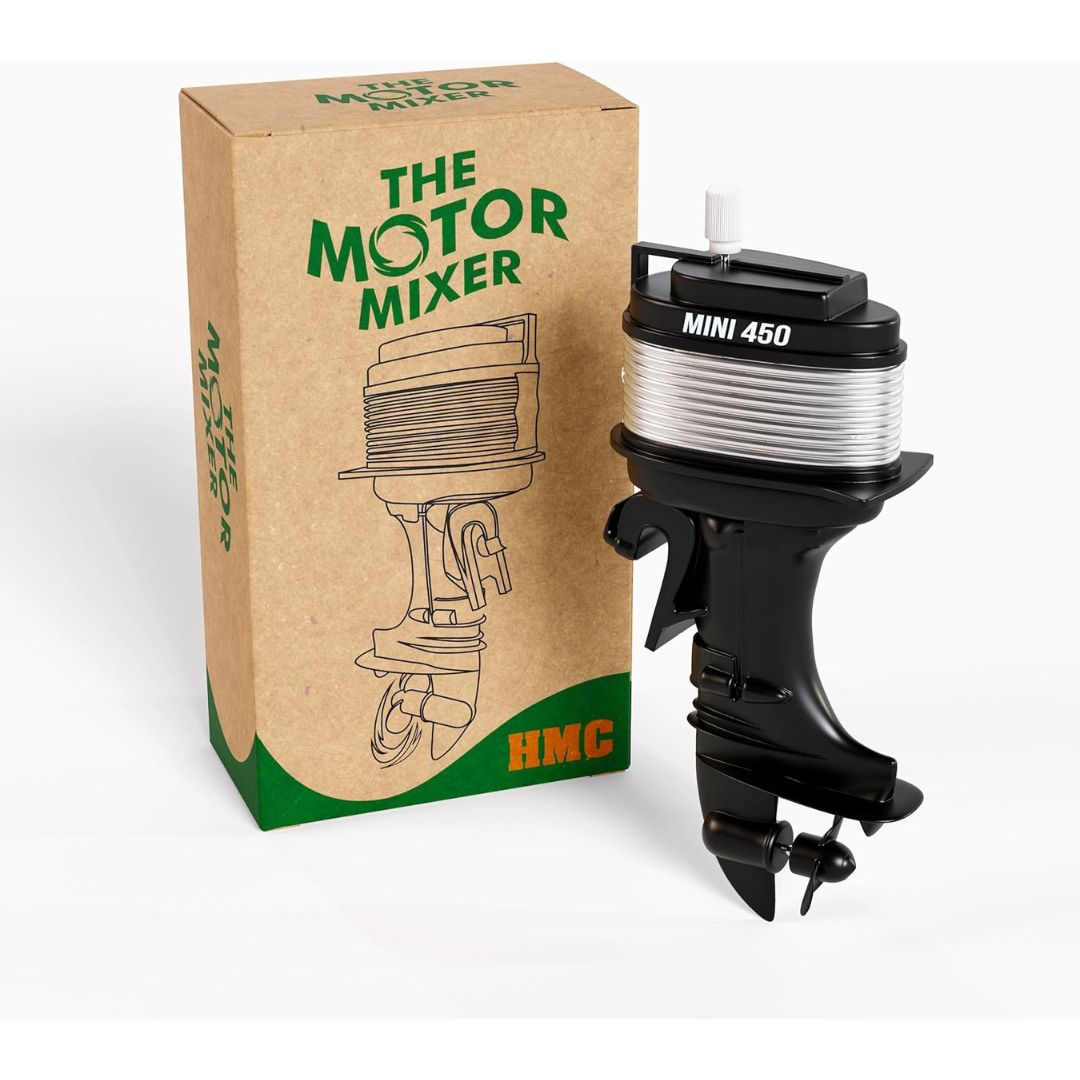A mini HMC outboard motor starter coil designed to be used as a coffee stirrer with its original brown cardboard packaging box on a white background.
