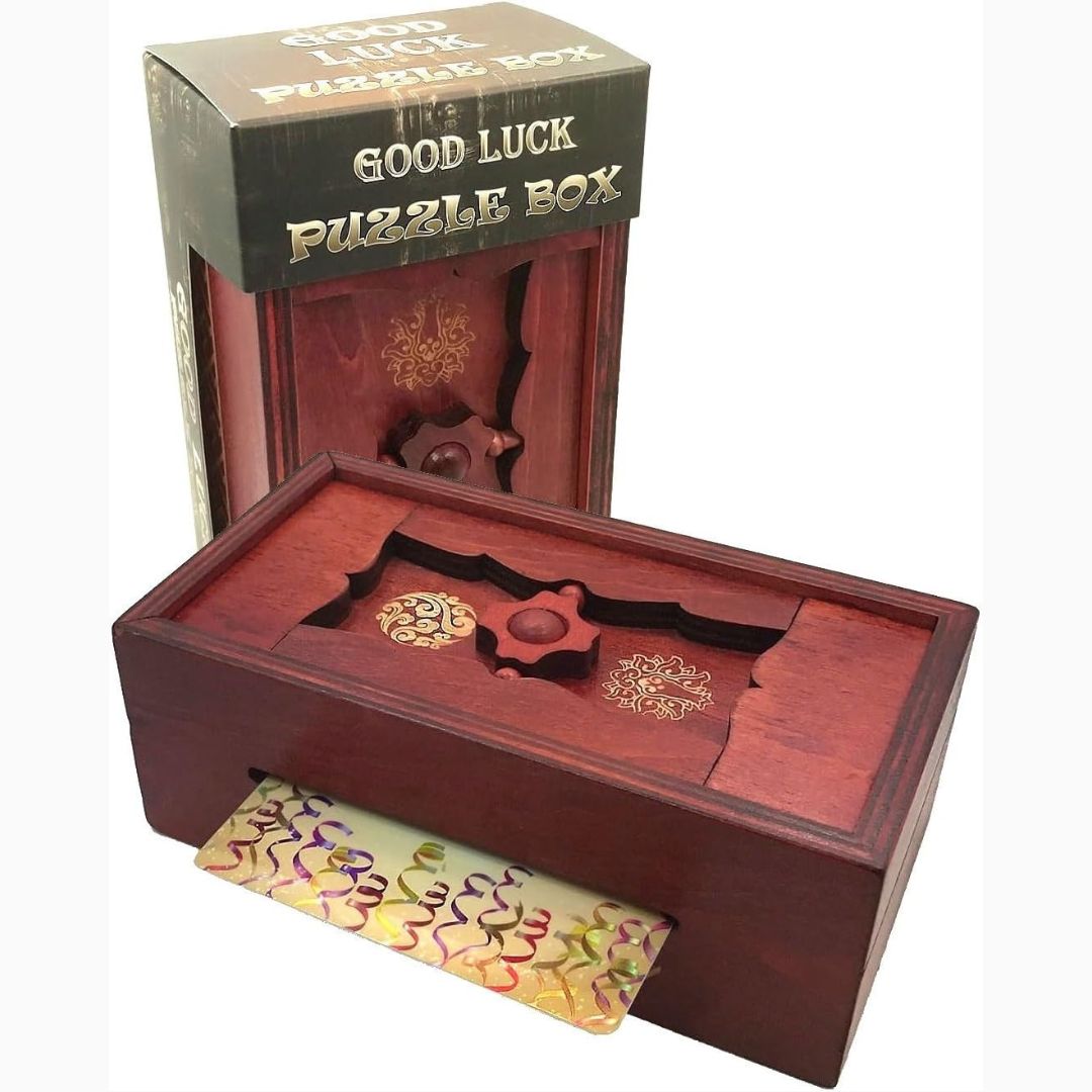 Wooden secret puzzle box with decorative elements and packaging against a white background.