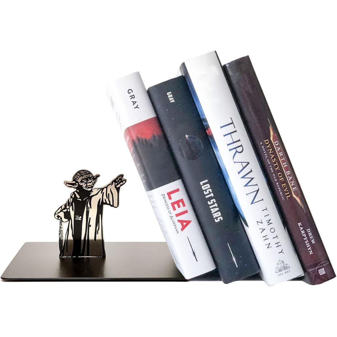 Bookend shaped like Yoda from 'Star Wars' holding books on a white background