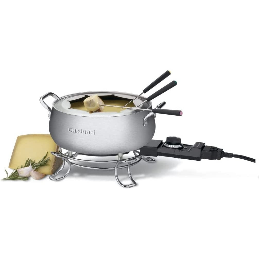 A Cuisinart fondue pot is plugged in with fondue and forks inside the pot.