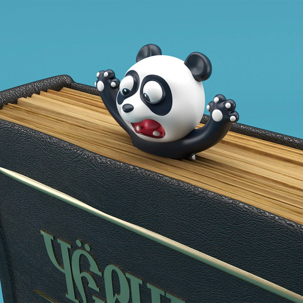 A 3D panda bookmark which appears to be yelling as half its body is squashed inside a book