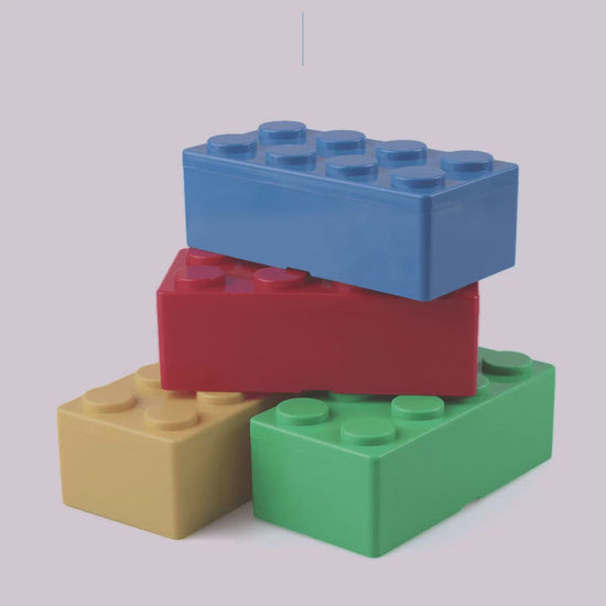 A video featuring oversized lego blocks which are actually storage boxes. There is fun music playing.